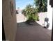 Charming patio area with desert landscaping, including gravel, cactus, and palm trees at 9728 N 106Th Pl # 154, Scottsdale, AZ 85258