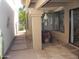 Covered patio space with tiled floor and view of gated walkway at 9728 N 106Th Pl # 154, Scottsdale, AZ 85258