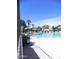 Large community pool with ample seating and umbrellas for residents' enjoyment at 9728 N 106Th Pl # 154, Scottsdale, AZ 85258