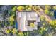 Birds eye view featuring rectangular pool, spa and flat roof on luxury home at 10119 E Winter Sun Dr, Scottsdale, AZ 85262
