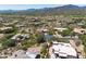 Overhead view of a luxury home in a desert community surrounded by mountain views at 10119 E Winter Sun Dr, Scottsdale, AZ 85262