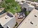 Aerial view of an outdoor living space featuring sofas and chairs on a brick patio at 10119 E Winter Sun Dr, Scottsdale, AZ 85262