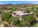 A birds eye view of the home highlighting the architecture, desert landscaping, and proximity to the community at 10119 E Winter Sun Dr, Scottsdale, AZ 85262