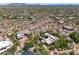A high altitude aerial view of the community highlighting the spacious desert home sites and desert landscaping at 10119 E Winter Sun Dr, Scottsdale, AZ 85262