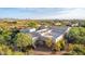 Two-story luxury home featuring a flat roof, with mature desert landscaping at 10119 E Winter Sun Dr, Scottsdale, AZ 85262