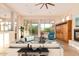 Living room with large windows, modern furnishings, and a view of the outdoor space at 10119 E Winter Sun Dr, Scottsdale, AZ 85262