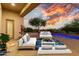 Inviting outdoor patio with comfortable seating, vibrant greenery, and a stunning sunset view creates a perfect relaxation space at 10119 E Winter Sun Dr, Scottsdale, AZ 85262
