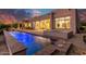 Beautiful backyard pool and hot tub with modern patio under a colorful sunset at 10119 E Winter Sun Dr, Scottsdale, AZ 85262