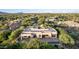 Expansive home featuring stucco, flat roofs, a pool, and a lush desert landscape at 10119 E Winter Sun Dr, Scottsdale, AZ 85262