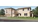 Beautiful new construction two-story home with a well-manicured lawn and neutral color palette at 10120 E Ulysses Ave, Mesa, AZ 85212