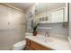 Bright bathroom with a tiled shower, vanity, decorative mirror, and plant accents at 10330 W Thunderbird Blvd # C207, Sun City, AZ 85351