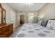 Bedroom showcasing hardwood floors, a ceiling fan, a bed, and a door leading to the bathroom at 10330 W Thunderbird Blvd # C207, Sun City, AZ 85351