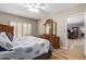 Bedroom showcasing hardwood floors, a ceiling fan, and a bed with a wooden dresser at 10330 W Thunderbird Blvd # C207, Sun City, AZ 85351