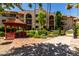 A charming red gazebo overlooks well-maintained landscaping and multi-story condos at 10330 W Thunderbird Blvd # C207, Sun City, AZ 85351