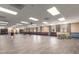 A spacious hall with tile floors and flexible layout with a piano, perfect for gatherings at 10330 W Thunderbird Blvd # C207, Sun City, AZ 85351