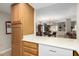 Bright kitchen with modern appliances and a view of the dining area with a glass table at 10330 W Thunderbird Blvd # C207, Sun City, AZ 85351