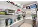 Walk-in pantry with storage shelving stocked with food, supplies, and small kitchen appliances at 10330 W Thunderbird Blvd # C207, Sun City, AZ 85351