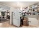 Hallway pass through pantry area with floor to ceiling shelving and a white refrigerator at 10330 W Thunderbird Blvd # C207, Sun City, AZ 85351