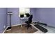 Bedroom featuring a functional workstation with a desk and chair, a fitness machine, and natural lighting at 1075 E Chandler Blvd # 210, Chandler, AZ 85225