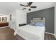 Inviting bedroom with a calm ambiance featuring a gray accent wall and stylish headboard with built-in lights at 1075 E Chandler Blvd # 210, Chandler, AZ 85225
