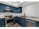 Well-lit kitchen with modern appliances, tile backsplash, and ample counter space at 1075 E Chandler Blvd # 210, Chandler, AZ 85225