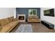 Inviting living room with a fireplace, stylish decor, and modern flooring at 1075 E Chandler Blvd # 210, Chandler, AZ 85225