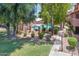 Community pool surrounded by lush trees, offering a private oasis for relaxation and recreation at 1075 E Chandler Blvd # 210, Chandler, AZ 85225