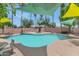 Community pool and spa area with shade coverings and lounge seating for residents' relaxation and enjoyment at 1075 E Chandler Blvd # 210, Chandler, AZ 85225