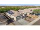 Desert home with solar panels, desert landscaping, wide driveway, with attractive trim and detailing at 13529 W Remuda Dr, Peoria, AZ 85383