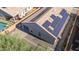 Aerial view of the house showcasing backyard patio and solar panels on the roof at 13529 W Remuda Dr, Peoria, AZ 85383