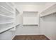 Walk-in closet features ample shelving and storage space for an organized wardrobe at 13529 W Remuda Dr, Peoria, AZ 85383
