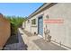 Exterior featuring a separate entrance to a suite or additional living quarters at 13529 W Remuda Dr, Peoria, AZ 85383