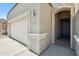 Close up on the front door and garage area of the house at 13529 W Remuda Dr, Peoria, AZ 85383