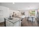 Open-concept living space includes a modern kitchen, living room with stylish decor, and a dining area at 13529 W Remuda Dr, Peoria, AZ 85383
