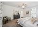 Comfortable Primary bedroom includes a dresser, stylish seating, and access to ensuite bathroom at 13529 W Remuda Dr, Peoria, AZ 85383