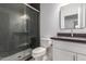 Updated bathroom with glass shower and gray vanity at 15131 W Melissa Ln, Surprise, AZ 85374