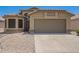 Inviting single-story home featuring a well-maintained yard and two-car garage, perfect for comfortable living at 15131 W Melissa Ln, Surprise, AZ 85374