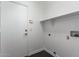 Laundry room with access door and shelving at 15131 W Melissa Ln, Surprise, AZ 85374