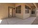 Covered patio area with access door and screens at 15131 W Melissa Ln, Surprise, AZ 85374