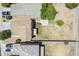 Aerial view showcasing the property's backyard, patio, and proximity to neighboring homes at 15205 N Honcho Ct, El Mirage, AZ 85335