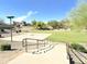 Community basketball court with green space and mature trees, offering recreational opportunities at 15205 N Honcho Ct, El Mirage, AZ 85335