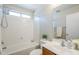 A bright bathroom with a shower-tub combo and a vanity at 15205 N Honcho Ct, El Mirage, AZ 85335