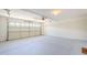 Spacious garage with painted floor and automatic door opener at 15205 N Honcho Ct, El Mirage, AZ 85335
