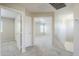 Upstairs hallway with neutral paint, carpet, and access to bedrooms at 15205 N Honcho Ct, El Mirage, AZ 85335