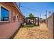 Lush backyard with a covered patio, raised garden beds, and ample space for outdoor activities and relaxation at 1531 W Campo Bello Dr, Phoenix, AZ 85023