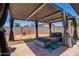 Outdoor living space with a covered patio, comfortable seating, and a stylish outdoor rug at 1531 W Campo Bello Dr, Phoenix, AZ 85023