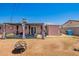 Spacious backyard featuring a covered patio area and a firepit, perfect for outdoor entertaining and relaxation at 1531 W Campo Bello Dr, Phoenix, AZ 85023