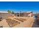 Expansive backyard with raised garden beds, a covered patio, and ample space for outdoor activities at 1531 W Campo Bello Dr, Phoenix, AZ 85023