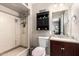 Bathroom featuring a shower and single sink vanity with updated fixtures at 1531 W Campo Bello Dr, Phoenix, AZ 85023