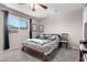 Inviting bedroom with soft gray walls, ceiling fan, and plush carpeting at 1531 W Campo Bello Dr, Phoenix, AZ 85023